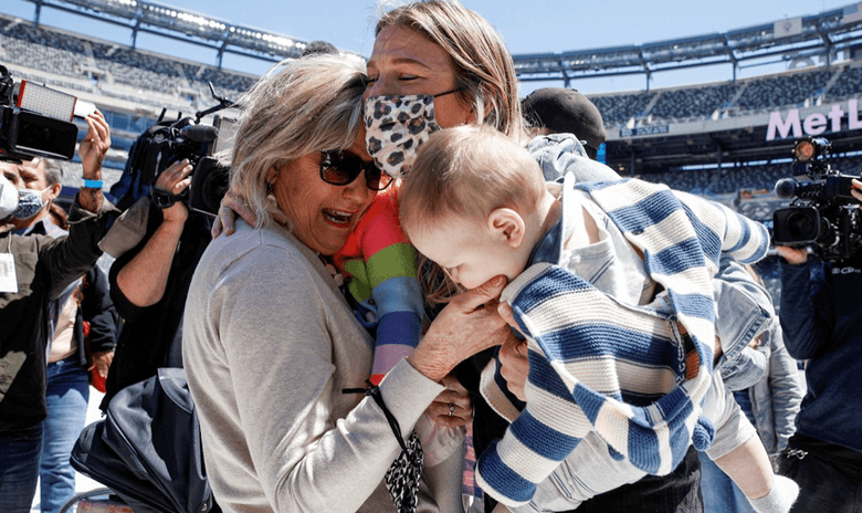 family hugging at Met Life stadium