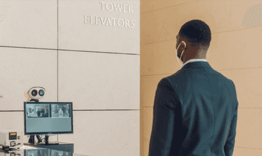 employee standing in front of machine 